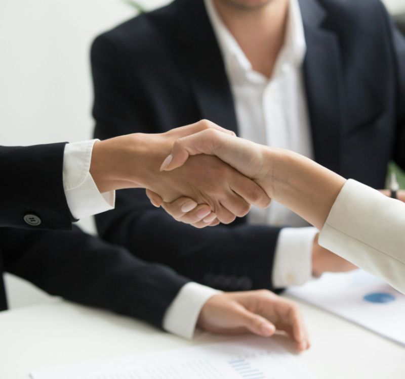 Business agreement handshake.